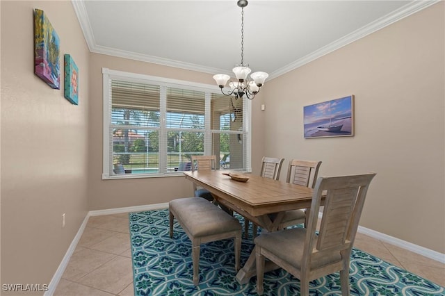 tiled dining area featuring crown molding and a chandelier