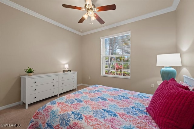 carpeted bedroom featuring crown molding and ceiling fan