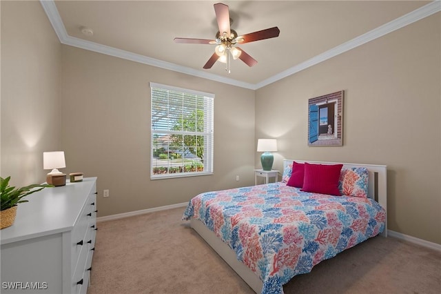 carpeted bedroom with ornamental molding and ceiling fan