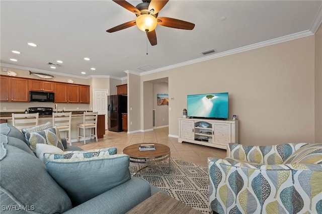 living room with crown molding, light tile patterned floors, and ceiling fan