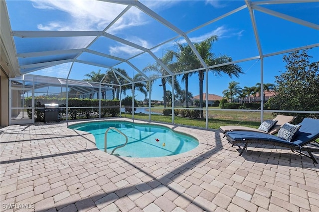 view of pool featuring a patio, a lanai, and a yard