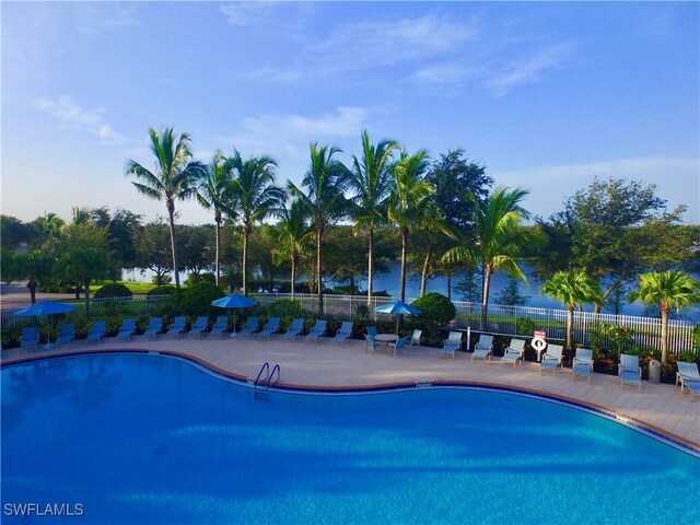 view of swimming pool with a water view