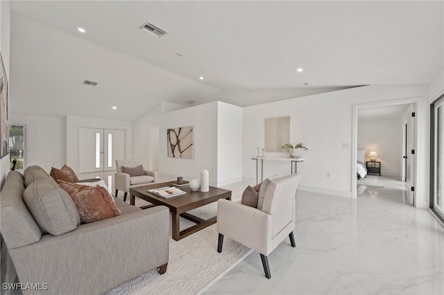 living room with french doors and vaulted ceiling