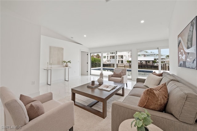 living room featuring lofted ceiling