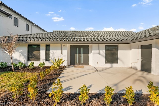 back of house with a patio