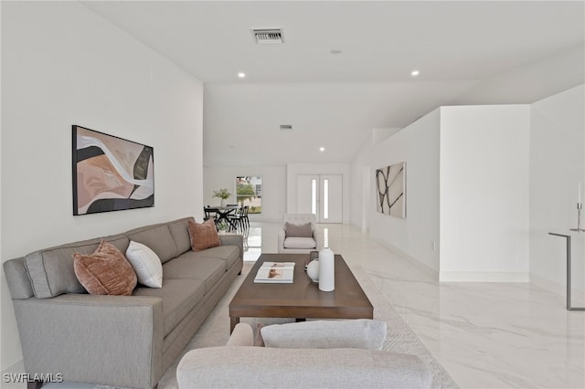 living room featuring vaulted ceiling