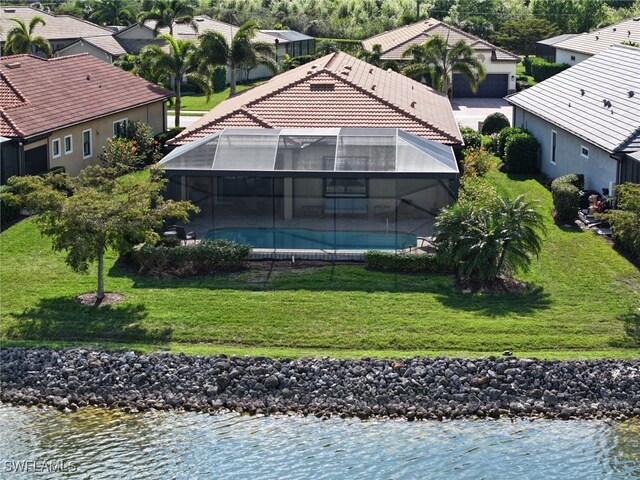 birds eye view of property featuring a water view