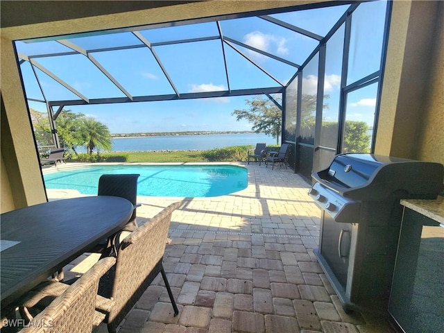 view of swimming pool with a water view, area for grilling, a lanai, and a patio area