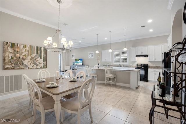 dining room featuring ornamental molding and light tile patterned floors