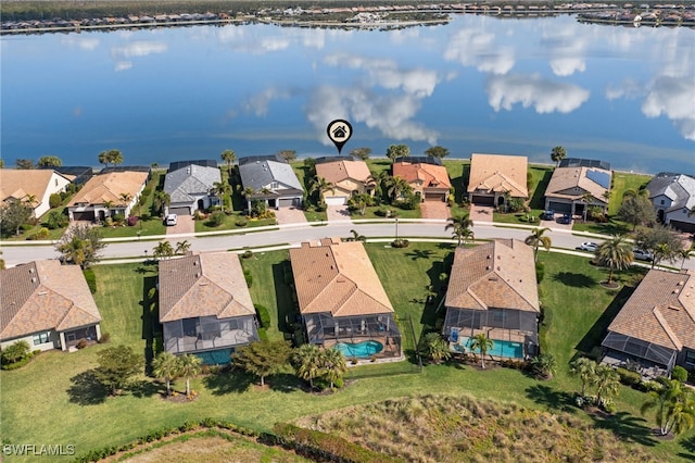 birds eye view of property featuring a water view