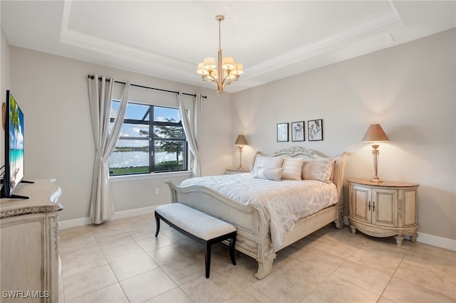 bedroom with an inviting chandelier, a raised ceiling, and light tile patterned flooring