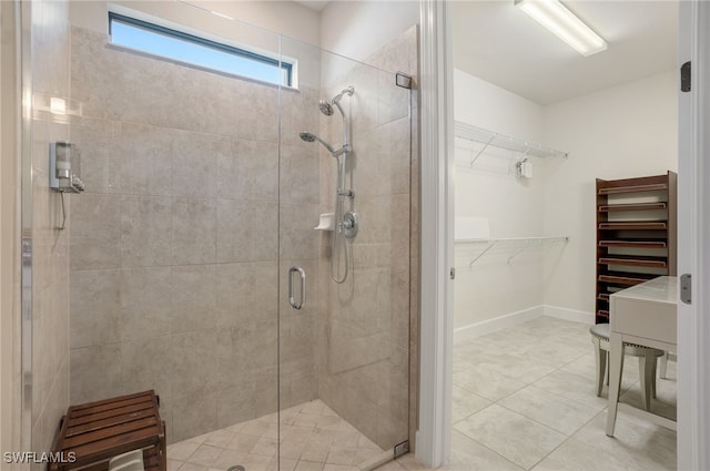 bathroom featuring tile patterned flooring and walk in shower