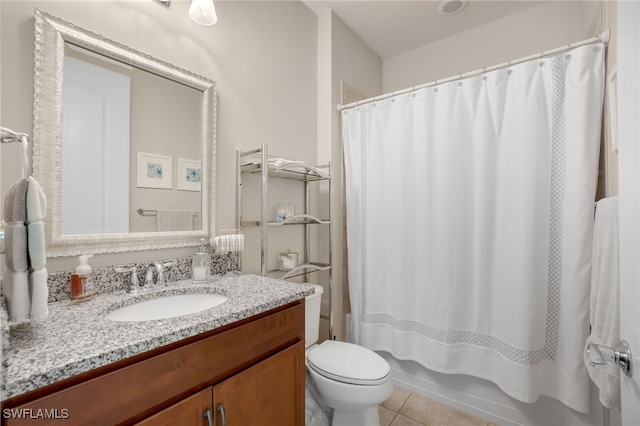 full bathroom with vanity, toilet, tile patterned flooring, and shower / bath combo