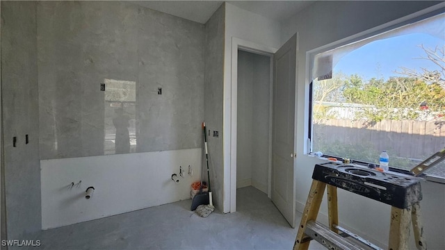 bathroom featuring concrete flooring