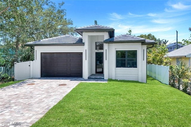 1312 Trail Terrace Dr, Naples, FL 34103 - view of front facade featuring a garage, decorative driveway, a tiled roof, and stucco siding