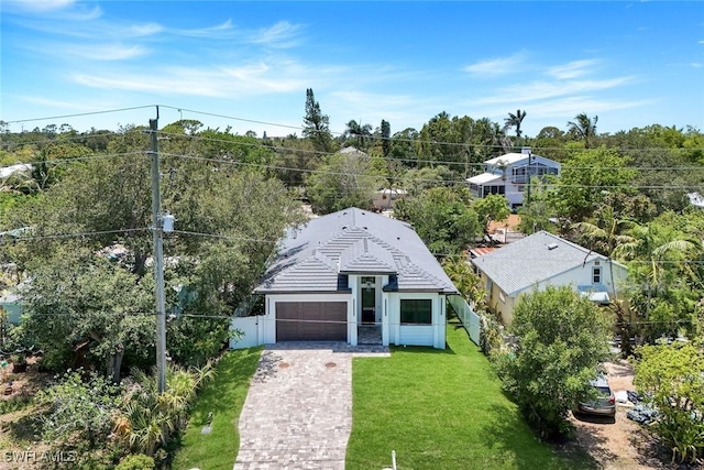 1312 Trail Terrace Dr, Naples, FL 34103 - view of front of home with a garage, decorative driveway, and a tile roof