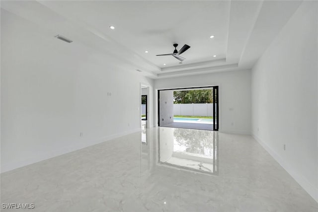 1312 Trail Terrace Dr, Naples, FL 34103 - spare room featuring recessed lighting, a tray ceiling, a ceiling fan, and baseboards