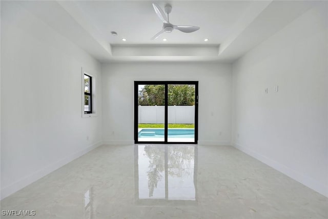 1312 Trail Terrace Dr, Naples, FL 34103 - empty room with a raised ceiling, baseboards, recessed lighting, and a ceiling fan