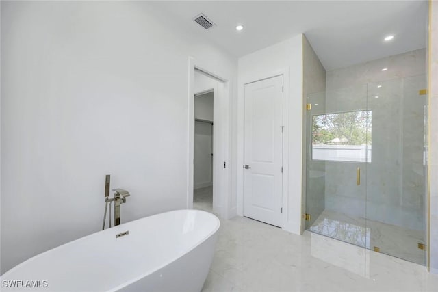 1312 Trail Terrace Dr, Naples, FL 34103 - bathroom featuring a shower stall, a soaking tub, marble finish flooring, and recessed lighting