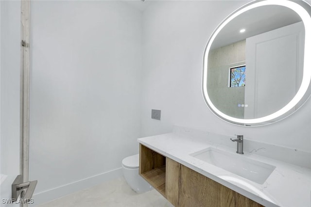 1312 Trail Terrace Dr, Naples, FL 34103 - bathroom with vanity, toilet, and baseboards
