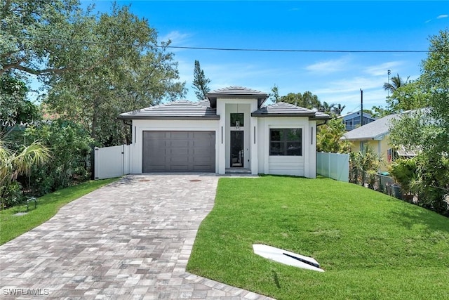 1312 Trail Terrace Dr, Naples, FL 34103 - prairie-style home with a garage, decorative driveway, a tile roof, and stucco siding