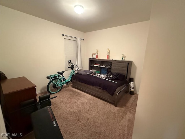 carpeted bedroom featuring baseboards