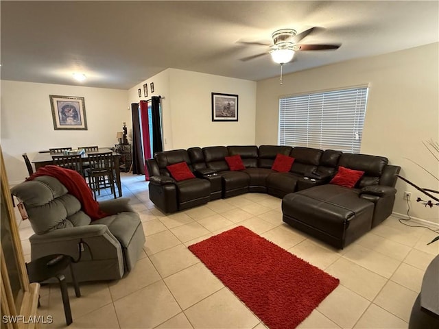 living room featuring light tile patterned floors and a ceiling fan