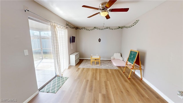 unfurnished room featuring ceiling fan and light hardwood / wood-style flooring