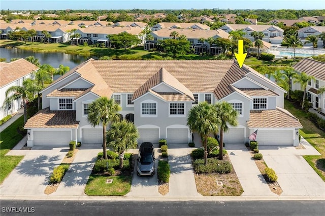 aerial view featuring a water view and a residential view