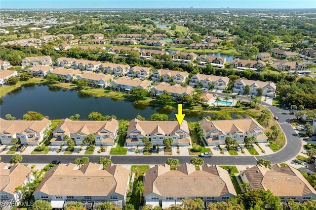 bird's eye view with a water view and a residential view