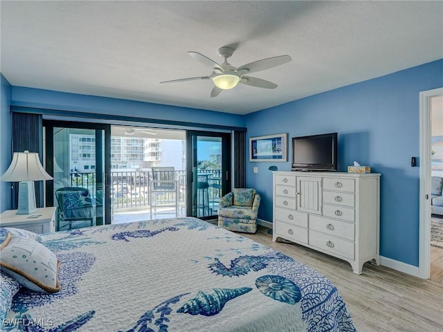 bedroom featuring light hardwood / wood-style flooring, access to outside, and ceiling fan