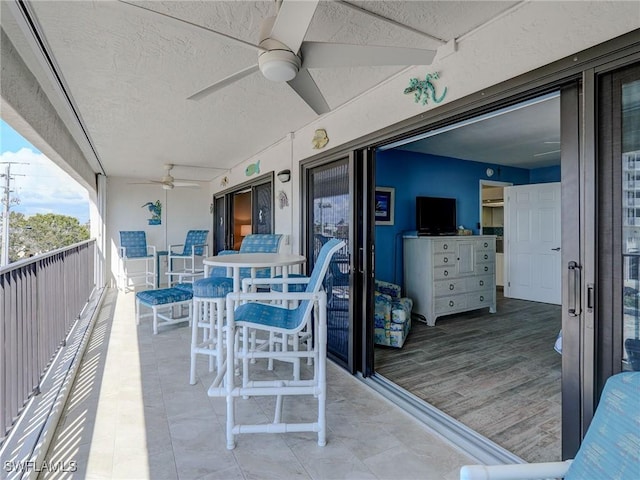 balcony featuring ceiling fan