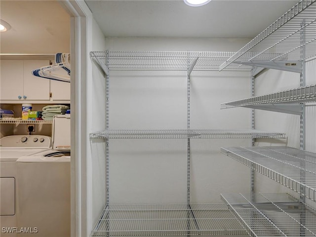 spacious closet featuring separate washer and dryer