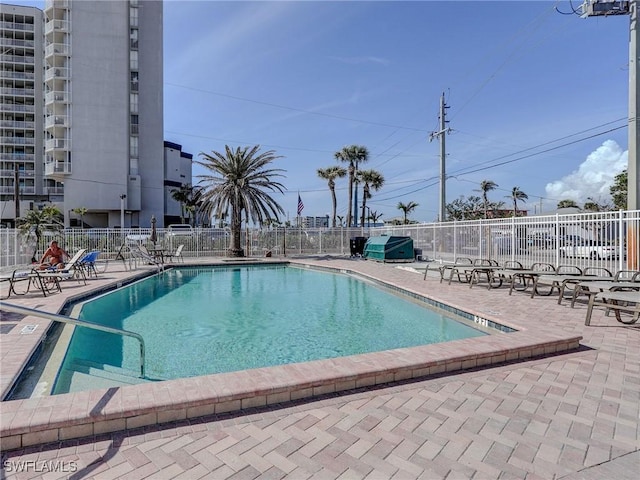 view of swimming pool featuring a patio area