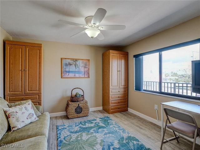 office area with light hardwood / wood-style floors and ceiling fan