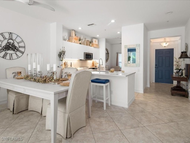 1045 Tarpon Cove Dr Unit 102, Naples, FL 34110 - dining area featuring recessed lighting, baseboards, visible vents, and light tile patterned floors