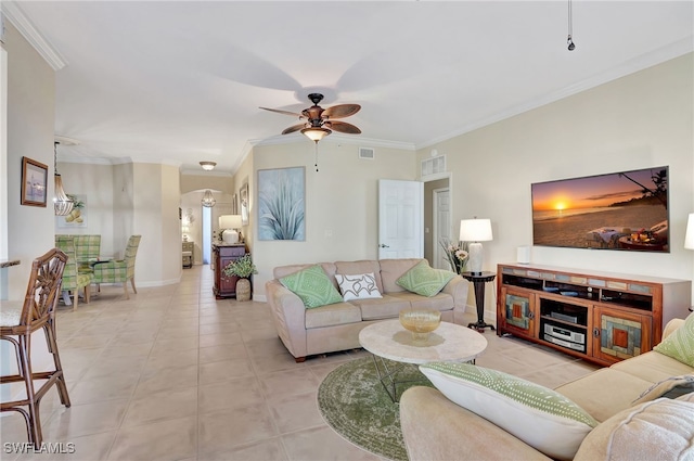 living room with tile patterned flooring, ornamental molding, and ceiling fan