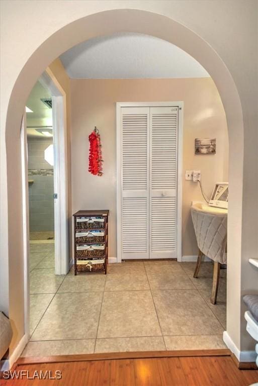 corridor featuring tile patterned floors