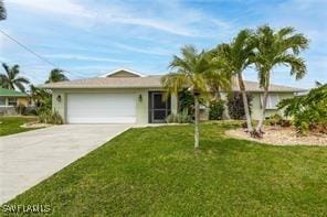 single story home with a garage and a front yard