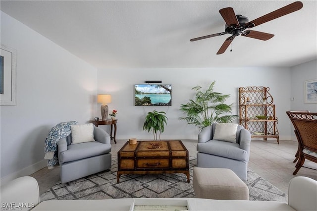 living room with light tile patterned flooring and ceiling fan