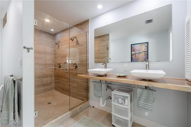 bathroom featuring vanity and walk in shower