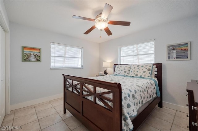 tiled bedroom with ceiling fan