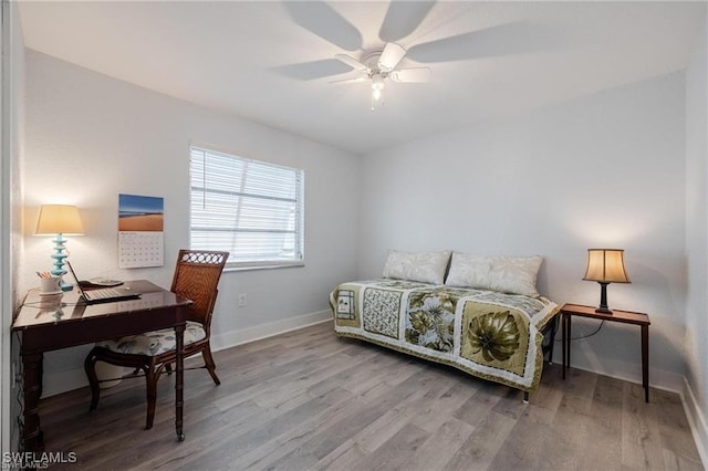 bedroom with hardwood / wood-style flooring and ceiling fan