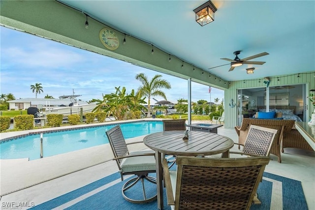 view of pool featuring ceiling fan and a patio