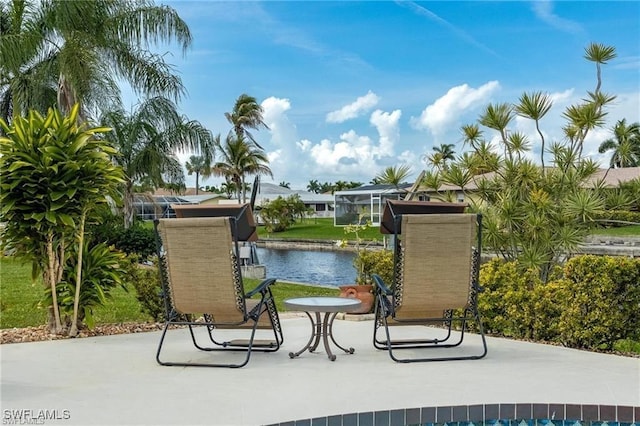 view of home's community featuring a patio area and a water view