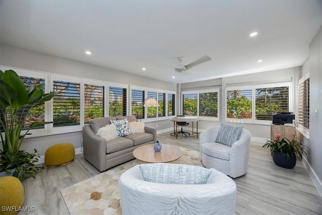 sunroom with a ceiling fan