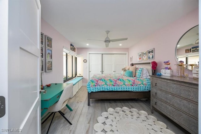 bedroom with a ceiling fan, recessed lighting, a closet, and wood finished floors