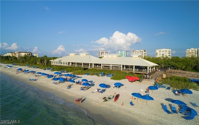 exterior space with a beach view and a water view