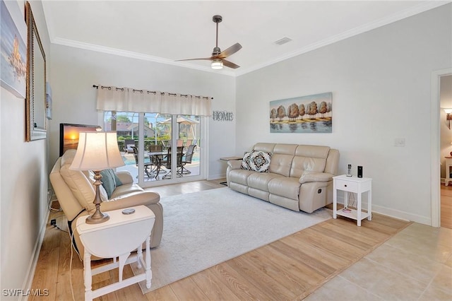 living room featuring hardwood / wood-style flooring, ornamental molding, and ceiling fan