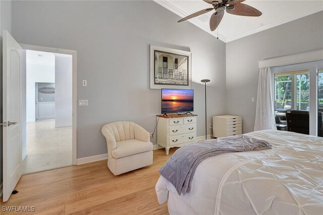 bedroom with crown molding, vaulted ceiling, access to outside, ceiling fan, and light hardwood / wood-style floors